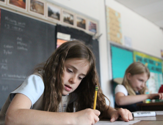 A child taking test at Dayspring Christian Academy 